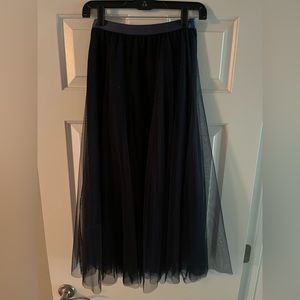 Chicwish tulle, pleated midi skirt with subtle sparkle.